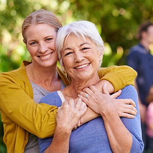 Woman and her mother smiling