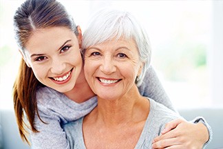 Woman and her mother smiling