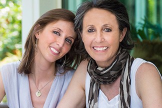 Woman and her mother smiling